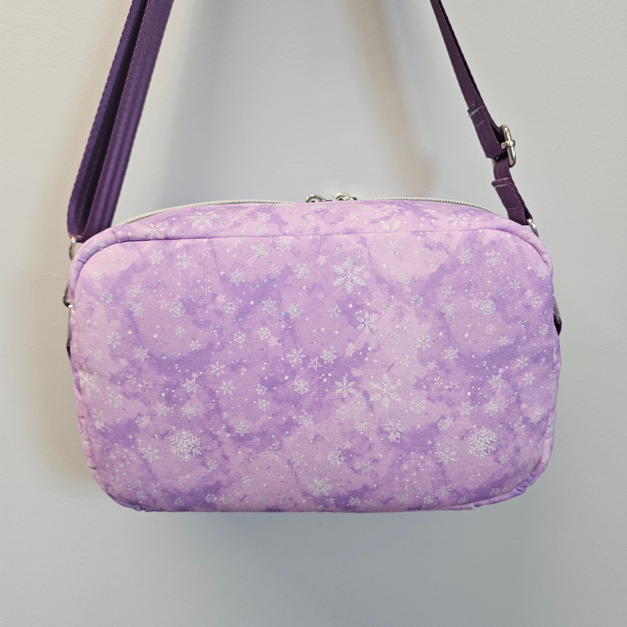 Purple floral-patterned case on a white background