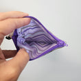 Load image into Gallery viewer, Purple wallet with striped interior held open by a hand against a light gray background
