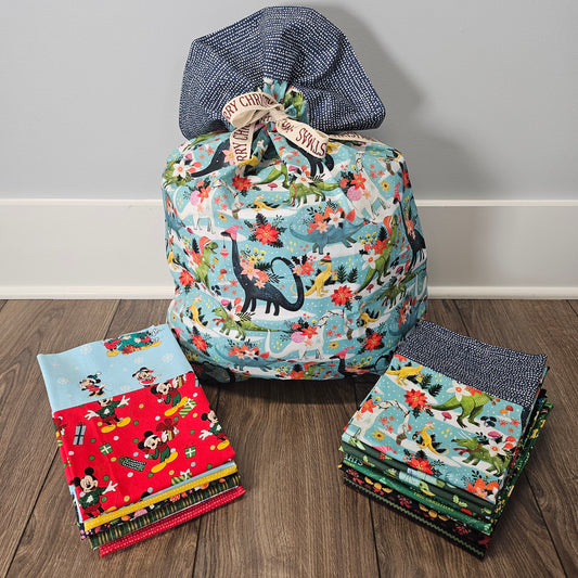 Christmas pillowcases that can be used as gift bags sitting on the floor.