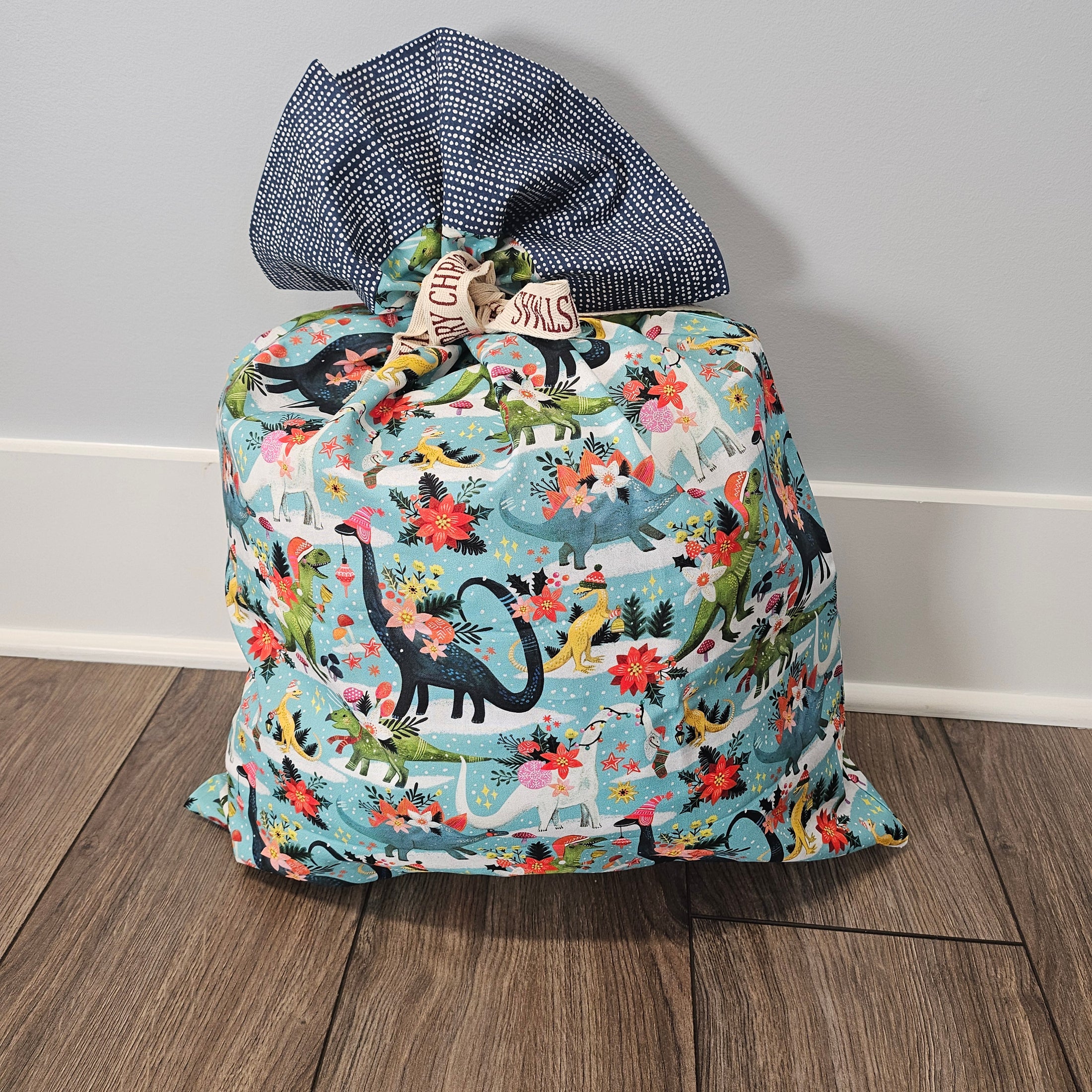 Floral and dinosaur-patterned holiday pillowcase.