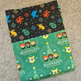 Load image into Gallery viewer, Hogwarts christmas pillowcase on a gray background.
