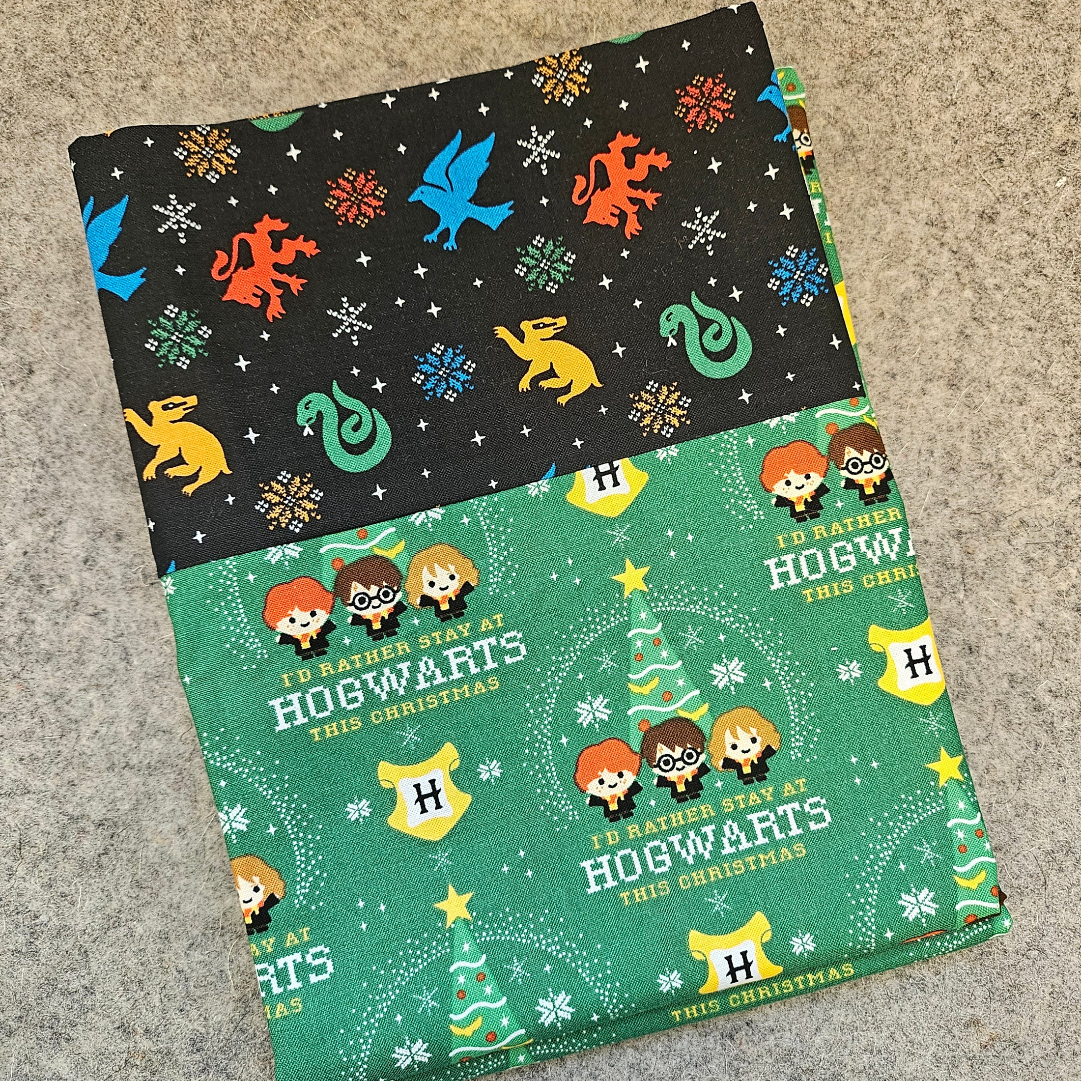 Hogwarts christmas pillowcase on a gray background.