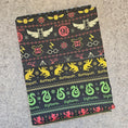 Load image into Gallery viewer, Fabric with Harry Potter-themed patterns on a gray surface
