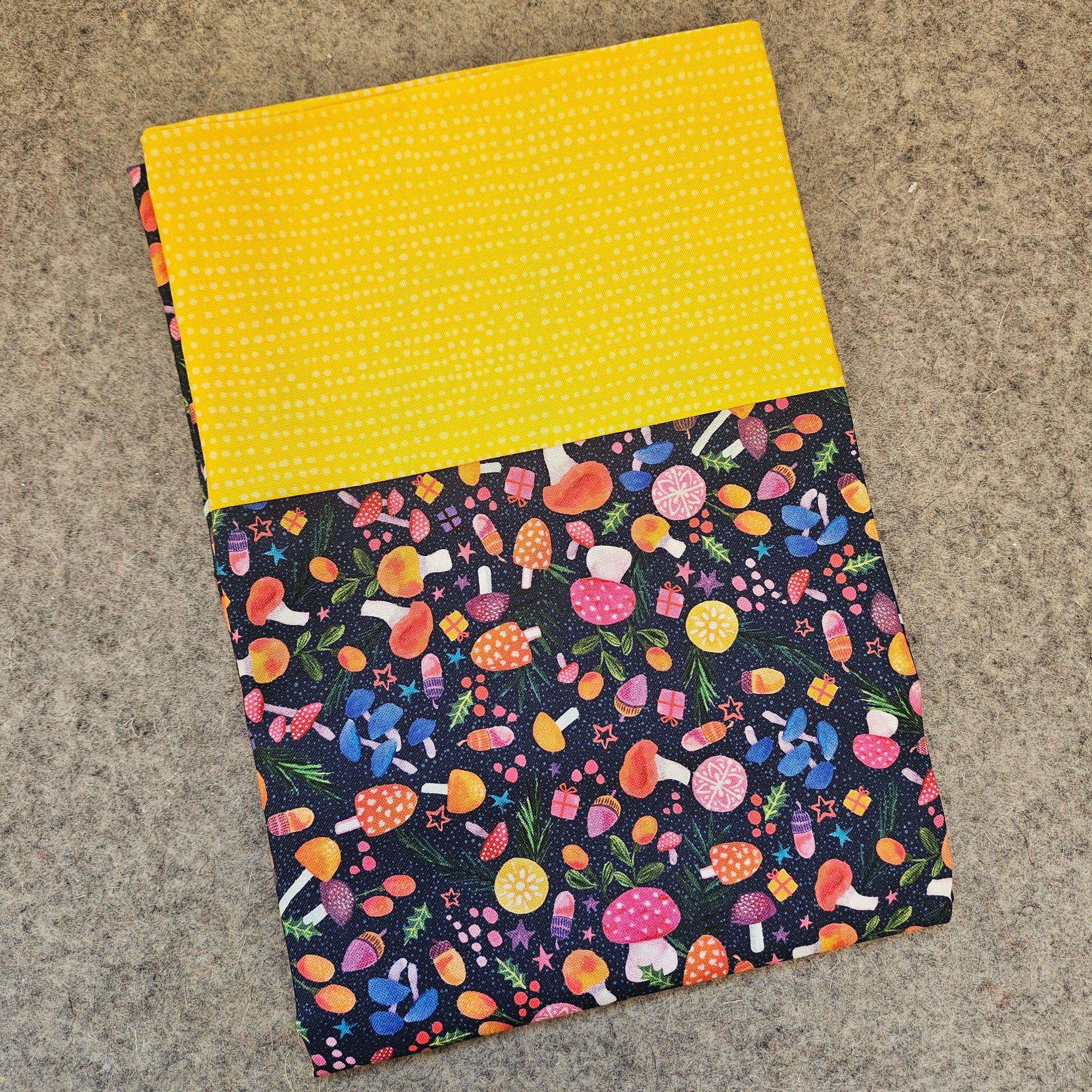 Christmas themed pillowcase featuring mushrooms and a yellow polka dot design.