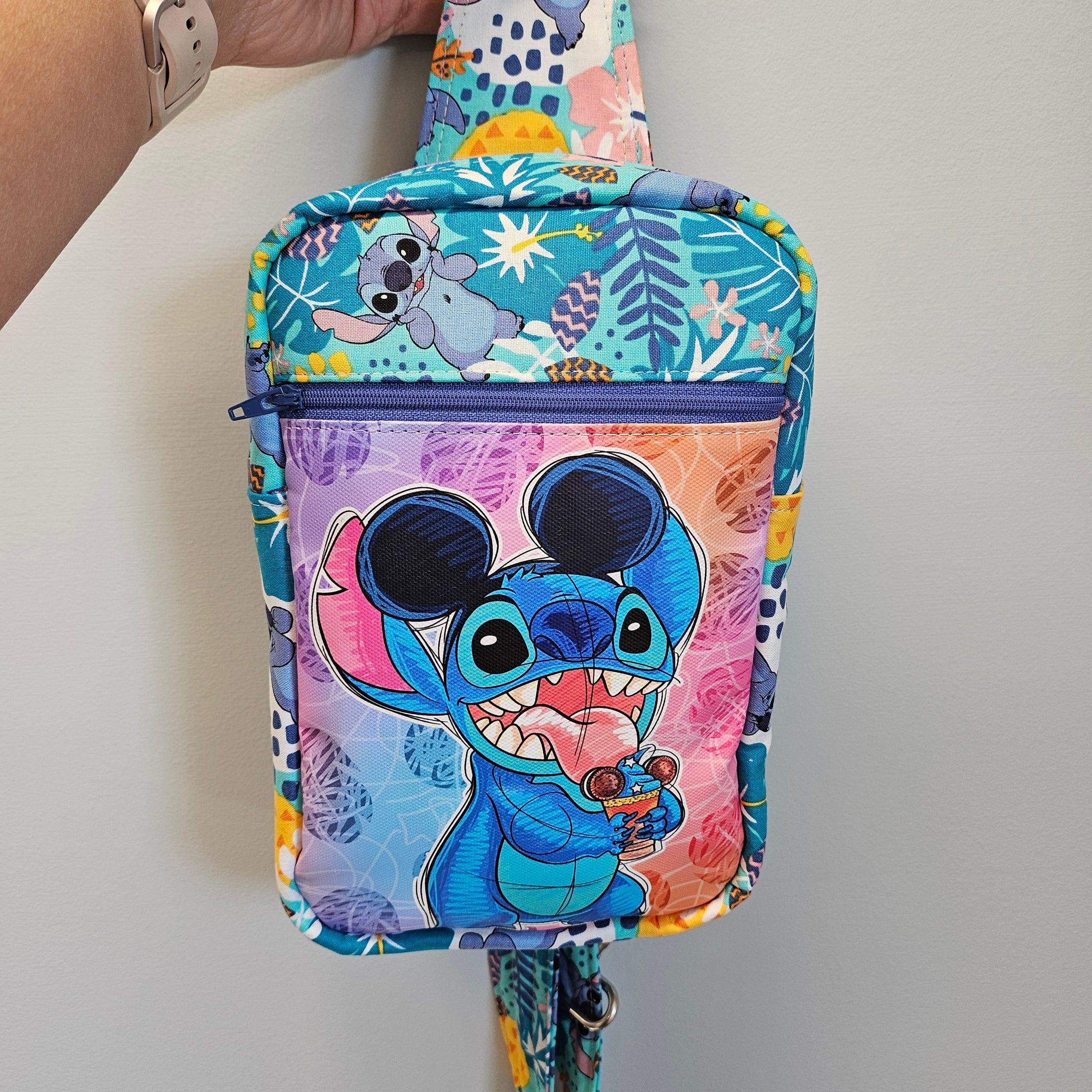 Colorful bag with cartoon character design on a plain background