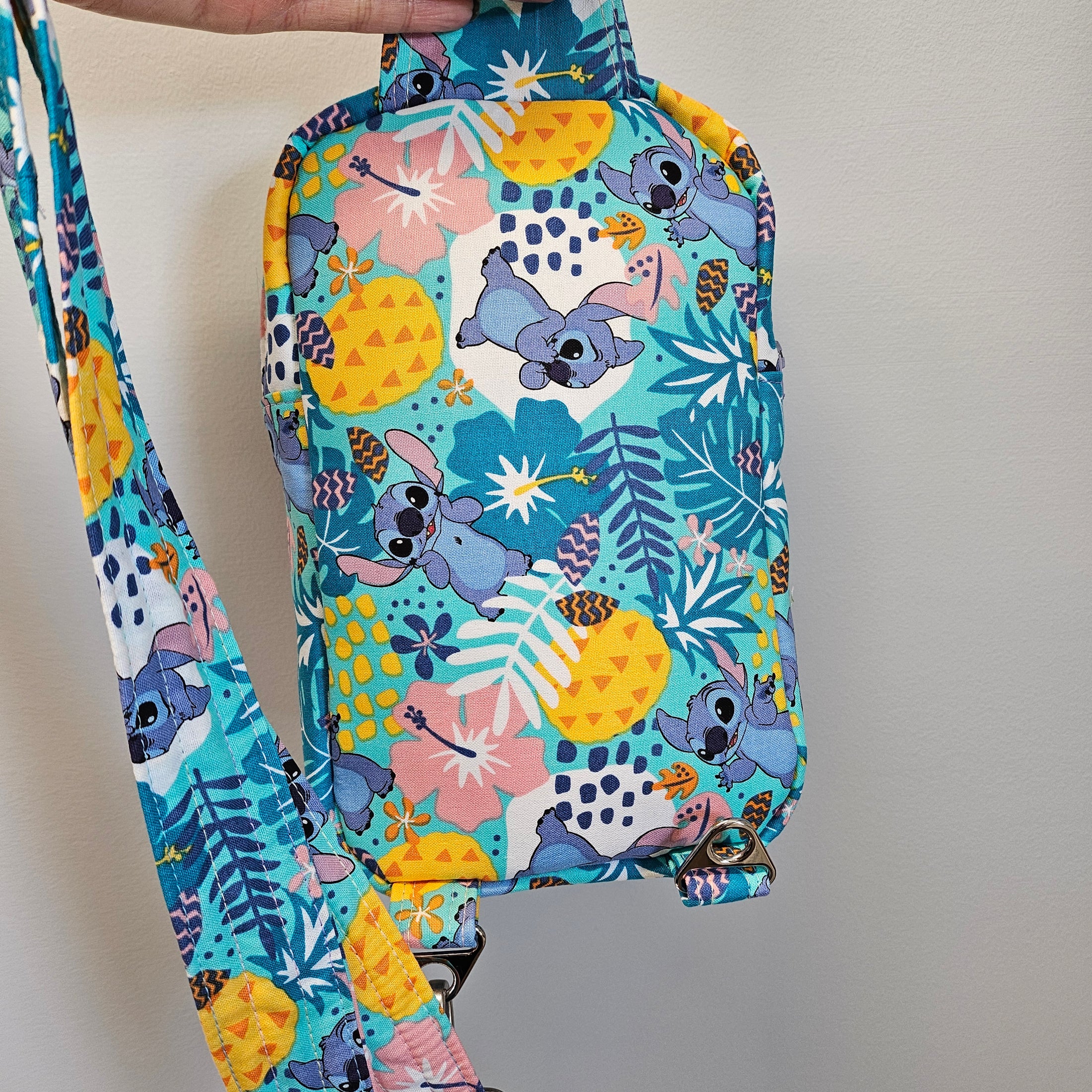 Colorful pouch with cartoon character design on a plain background