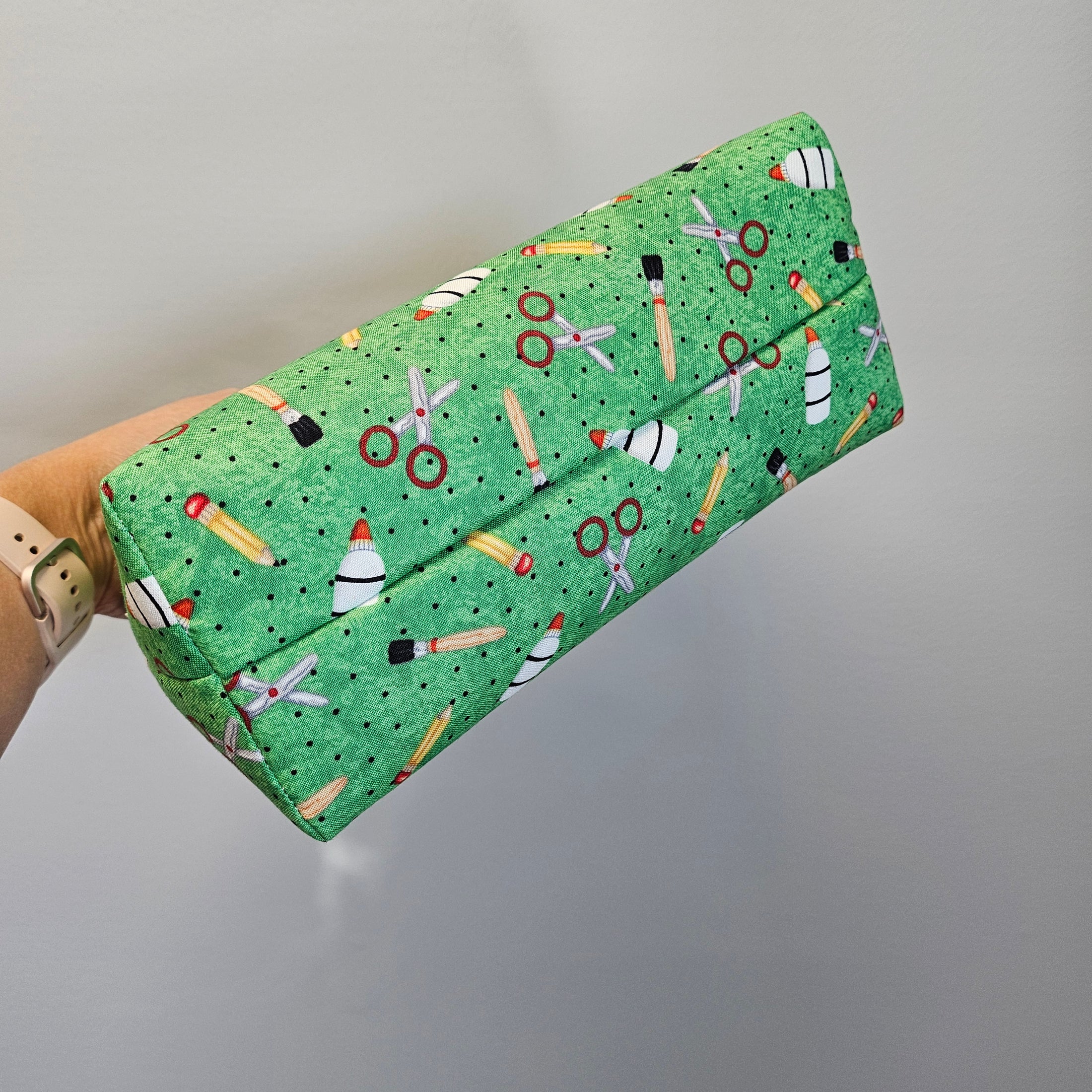 Bottom of the green school supplies zipper bag.