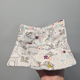 Load image into Gallery viewer, Bowl cozy with birds and birdcages on a gray background
