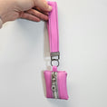 Load image into Gallery viewer, Pink belt with a silver buckle and matching pouch on a white background
