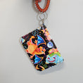 Load image into Gallery viewer, Colorful dragon-themed keychain with a coiled cord on a light gray background
