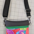 Load image into Gallery viewer, Colorful pouch with a black strap on a grid background
