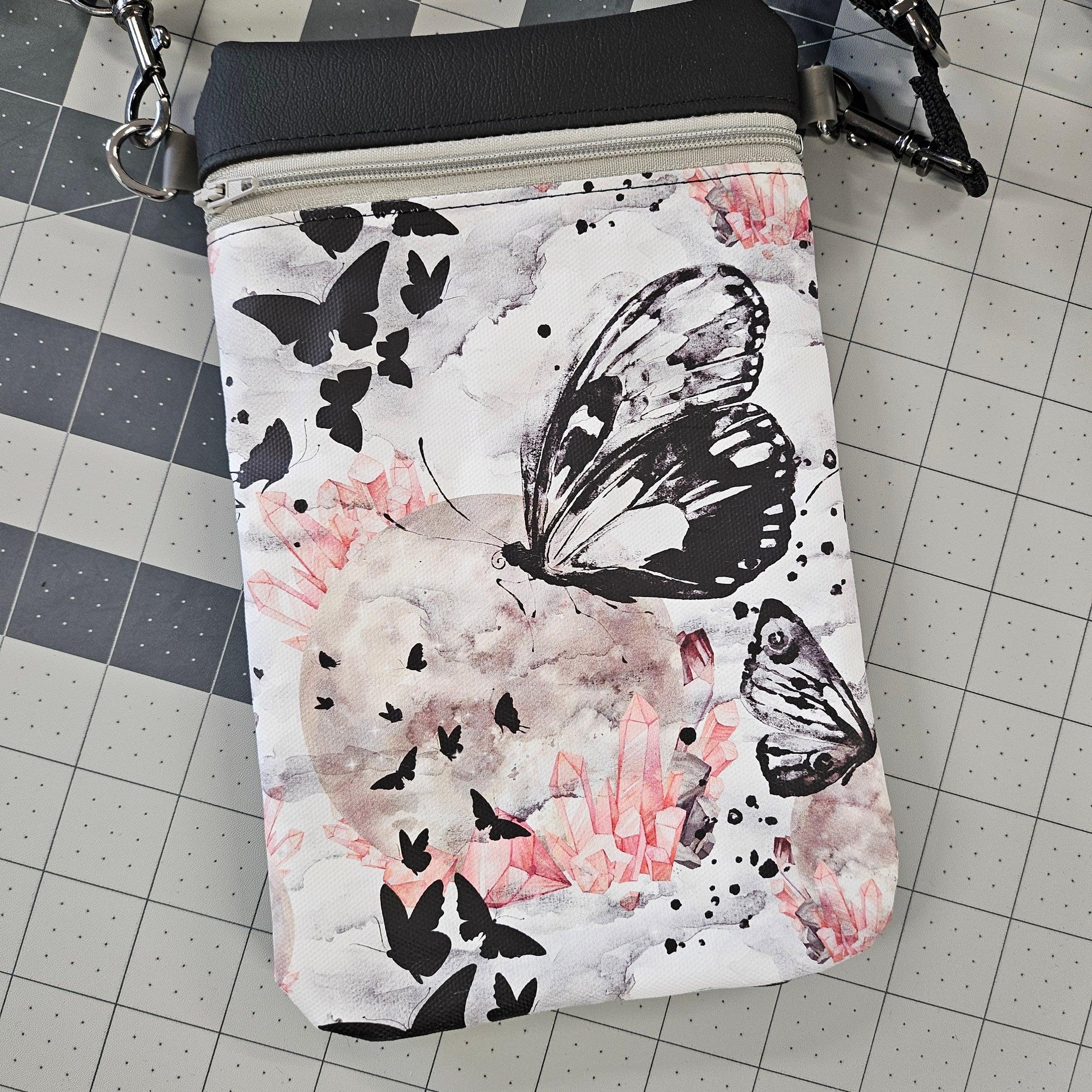 Pouch with butterfly design on a grid background