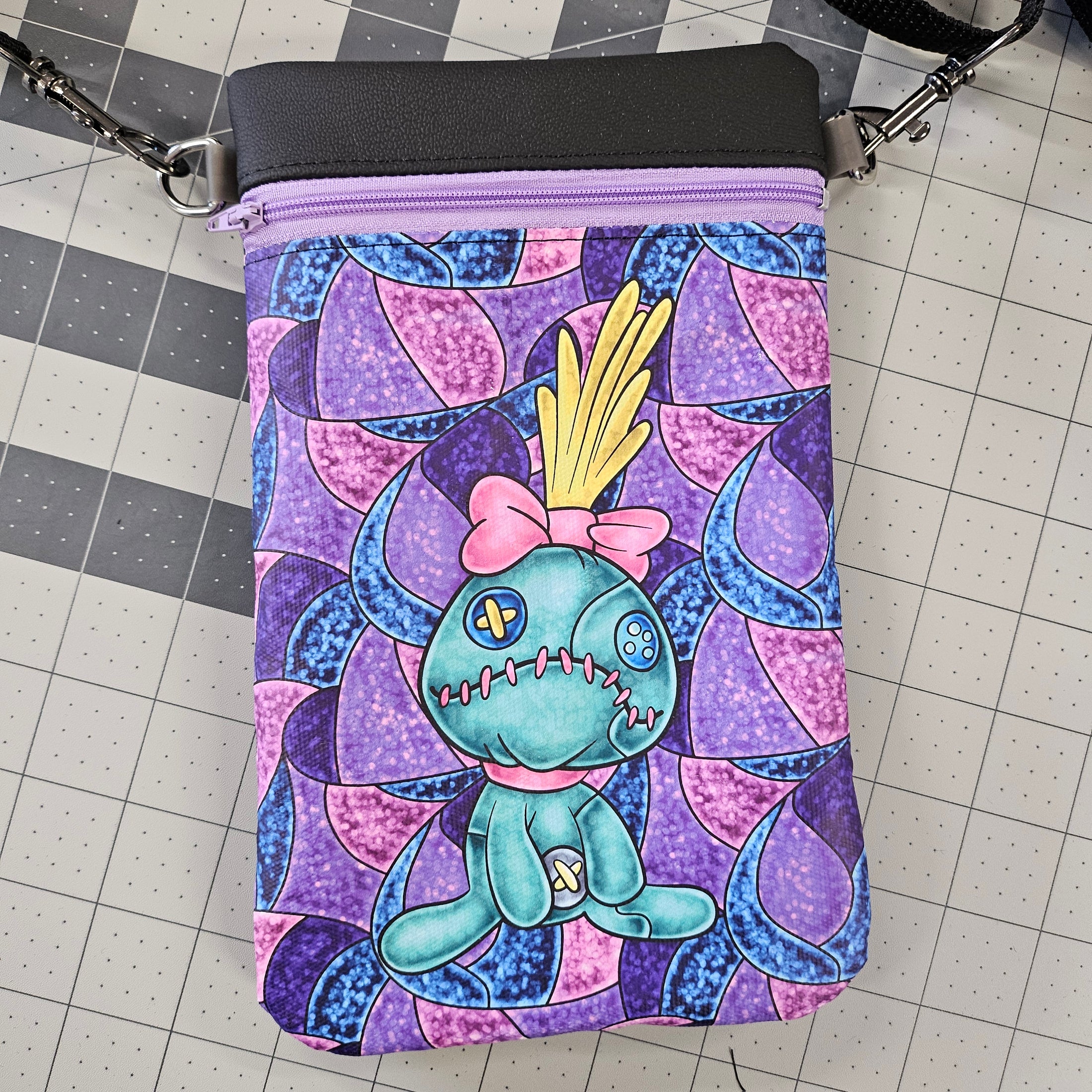 Colorful bag with cartoon character design on a grid background