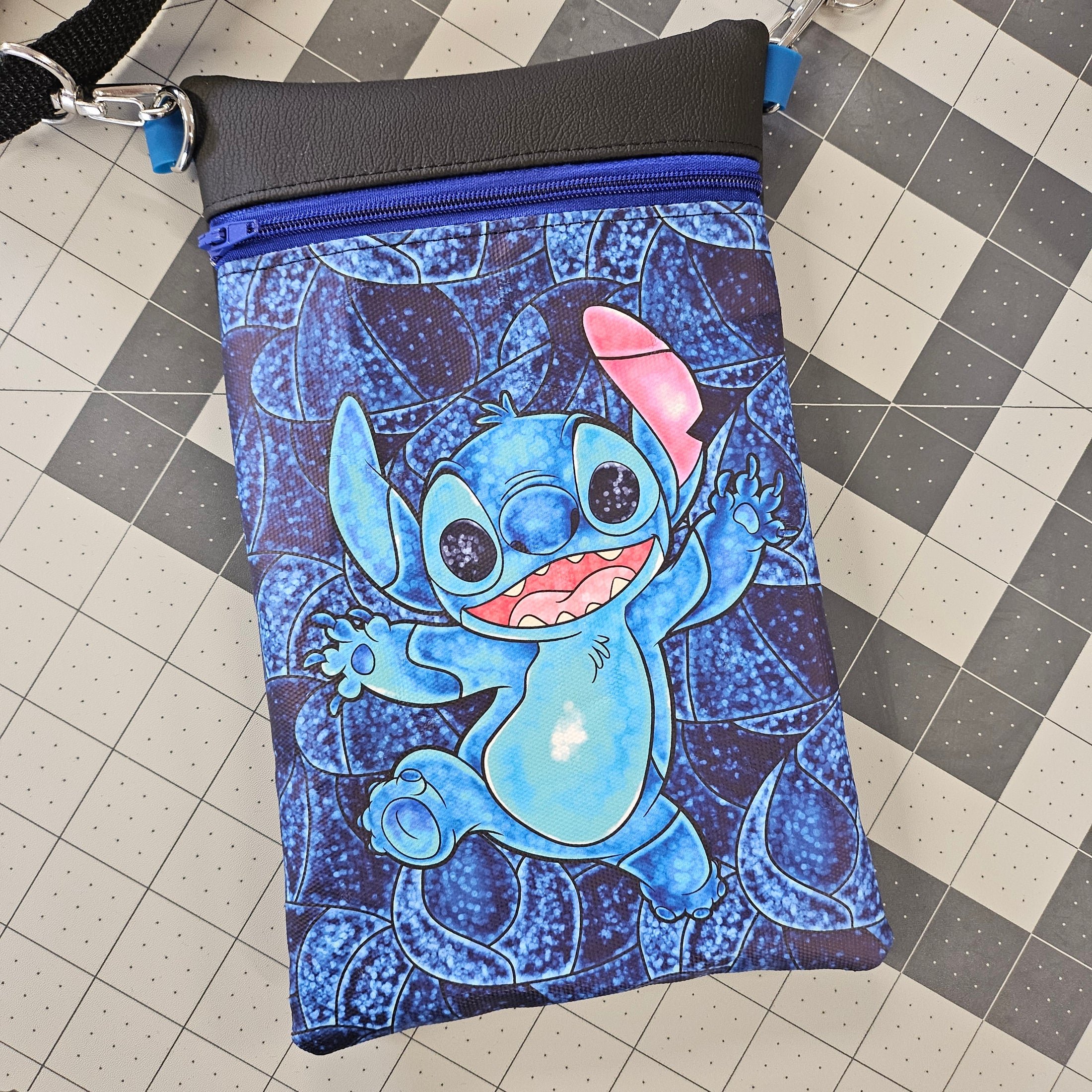 Blue character pouch on a checkered floor
