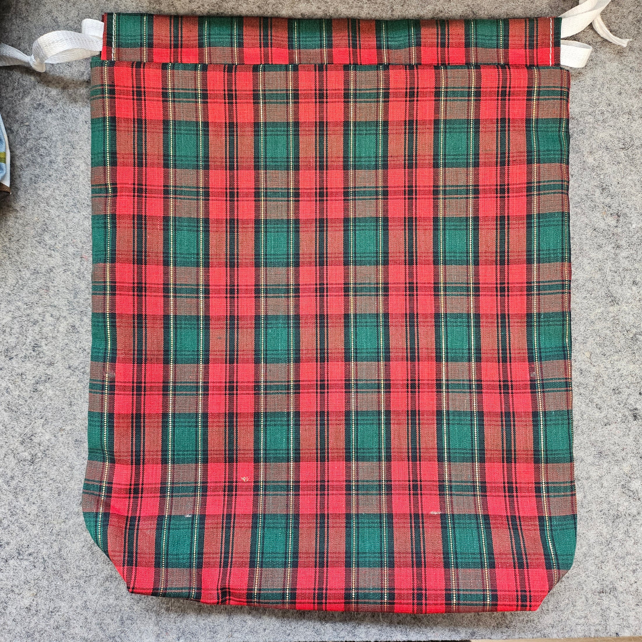 Red and green plaid reusable gift bag.