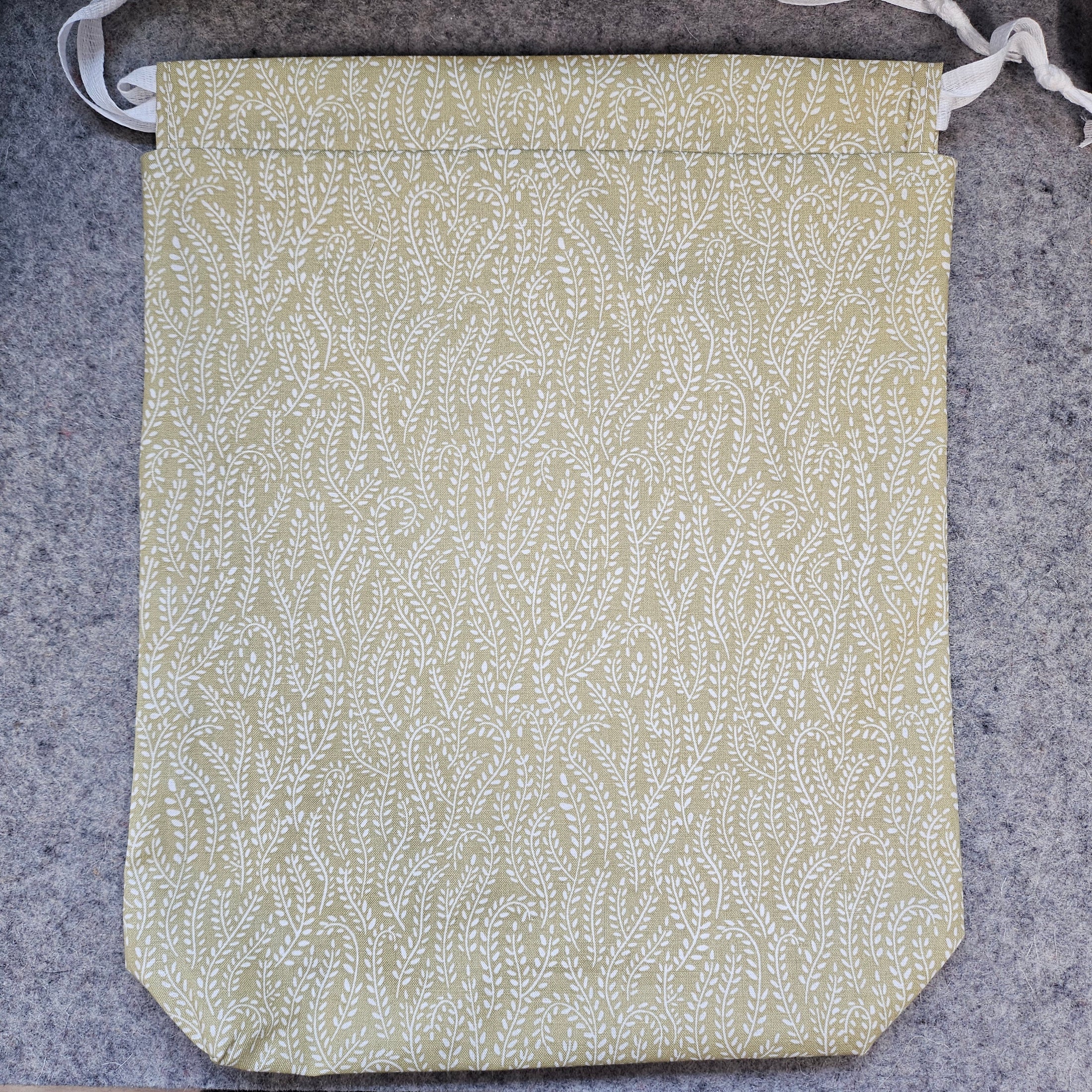Fabric with a leaf pattern on a gray surface