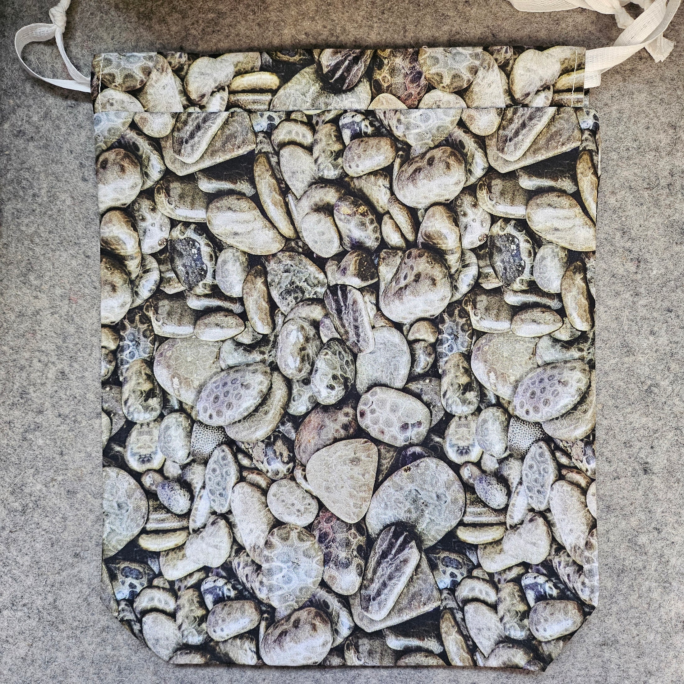 Petoskey stones themed drawstring bag with white ties.