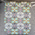 Load image into Gallery viewer, Patterned pouch with butterfly design on a gray surface
