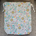 Load image into Gallery viewer, Easter themed drawstring bag with white ties.
