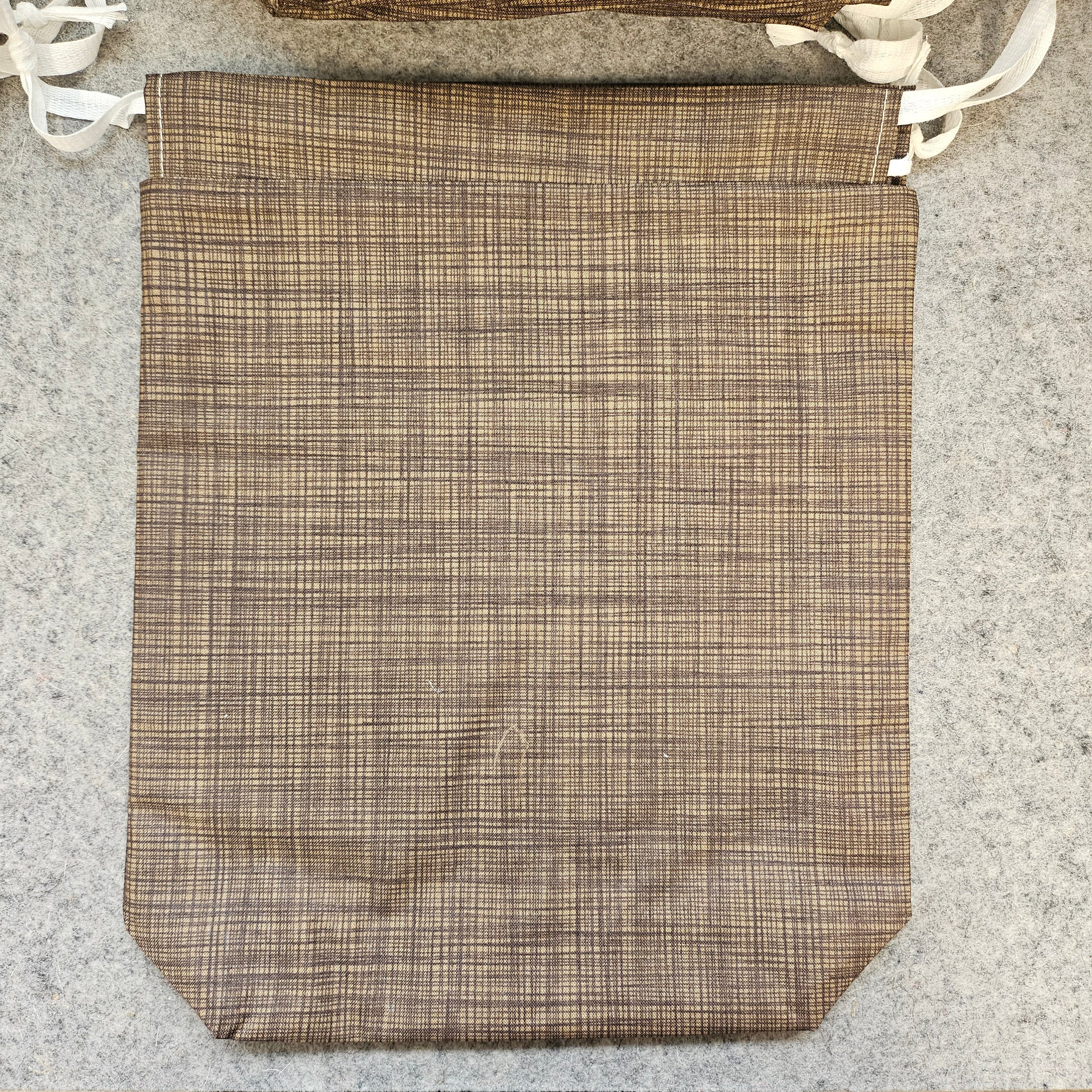 Brown reusable drawstring bag.