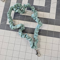Load image into Gallery viewer, Turquoise skinny scrunchie lanyard laying on a gray cutting mat. 
