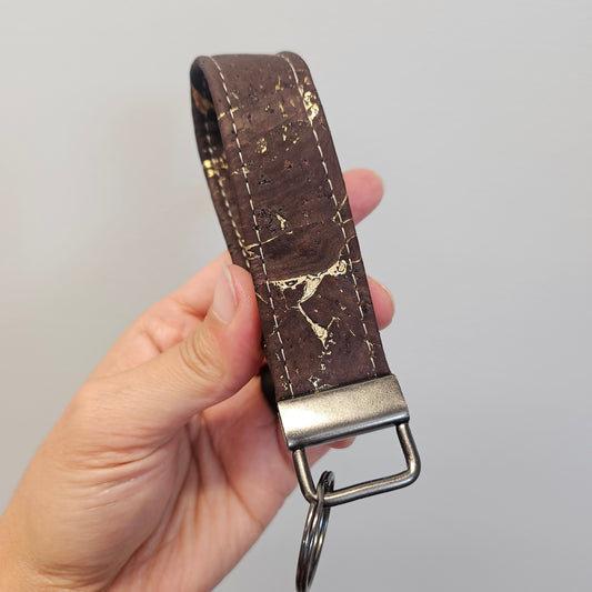 Brown and gold cork keychain.