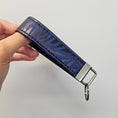 Load image into Gallery viewer, Blue and black cork key fob.
