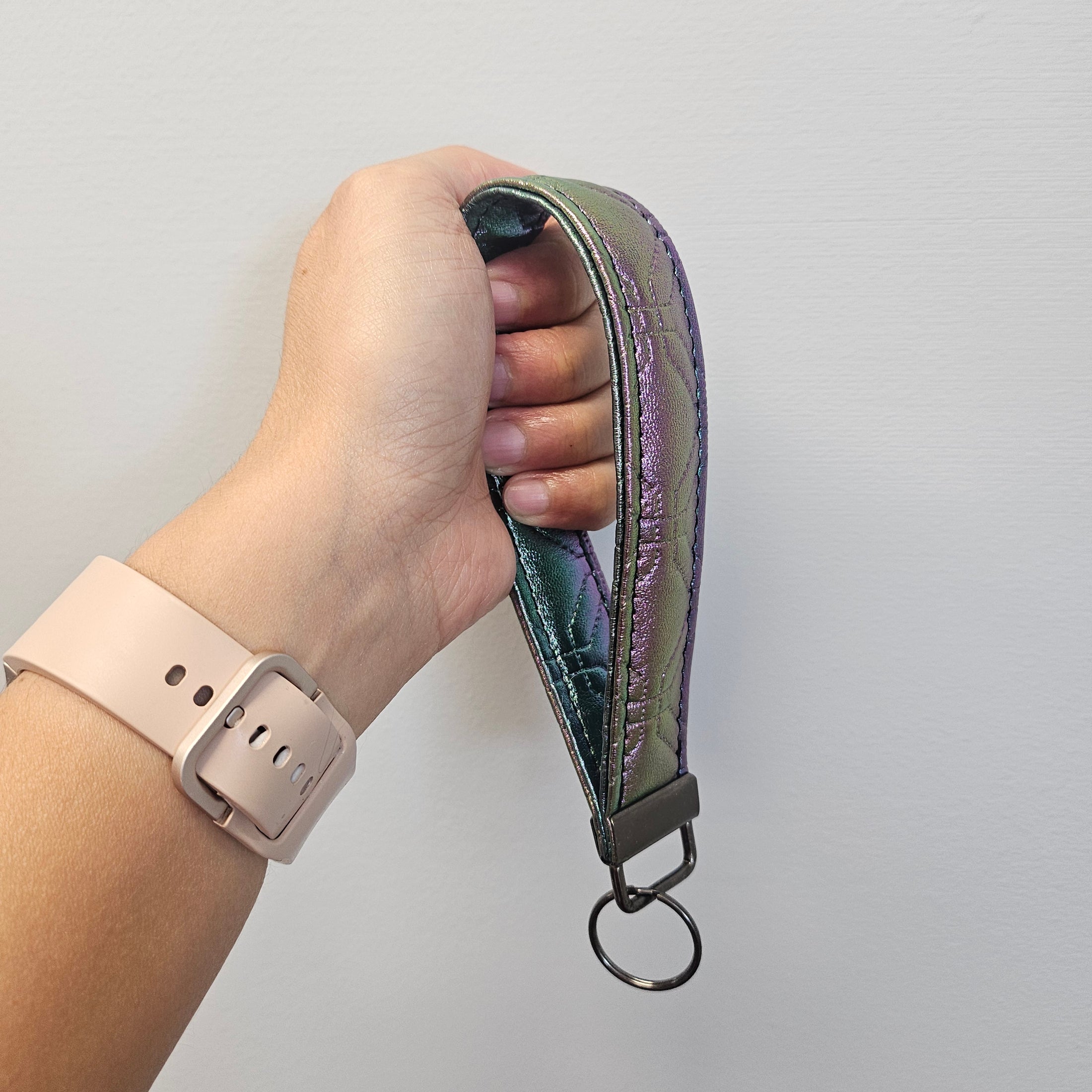 Metallic gradient quilted faux leather key fob.