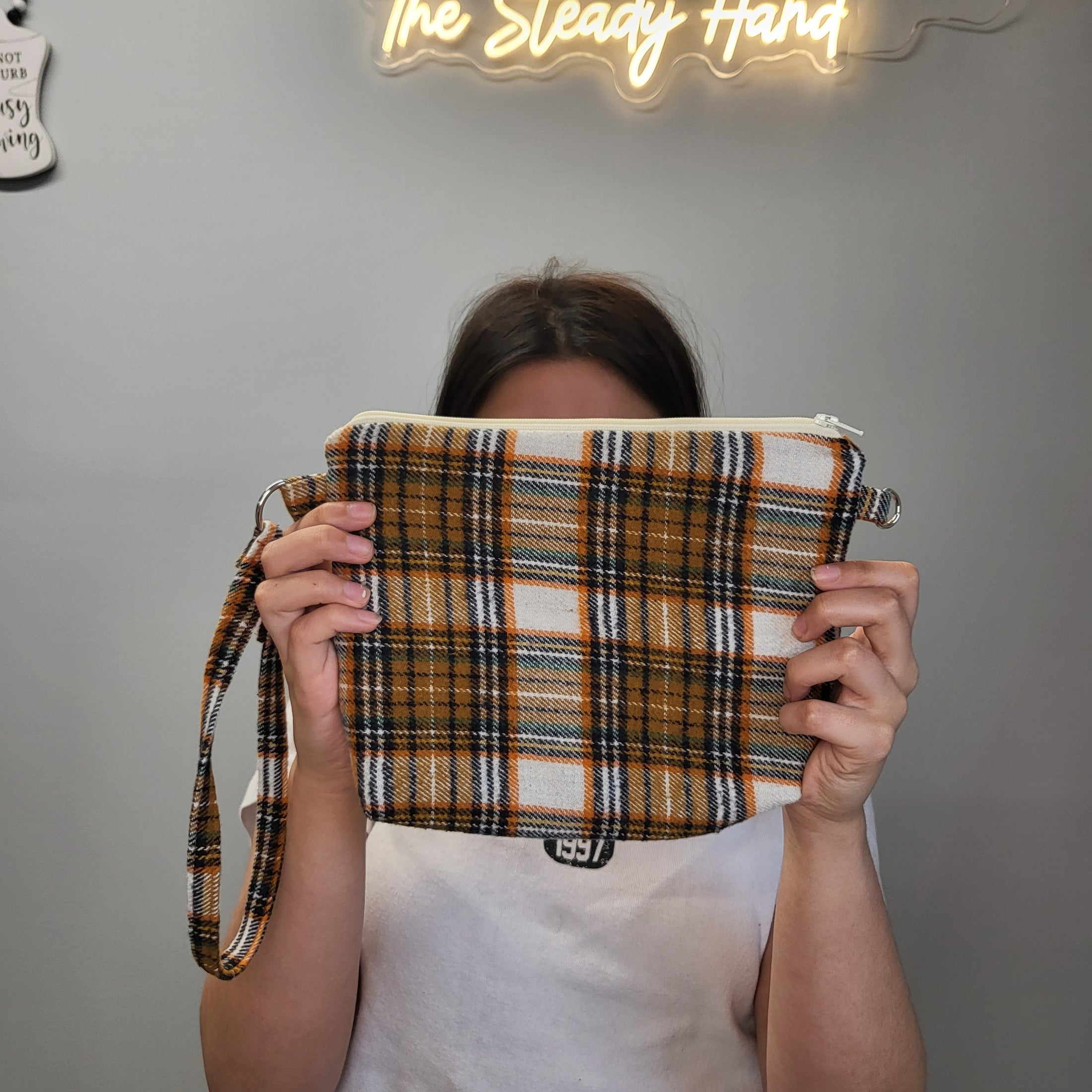 Orange and brown flannel clutch.