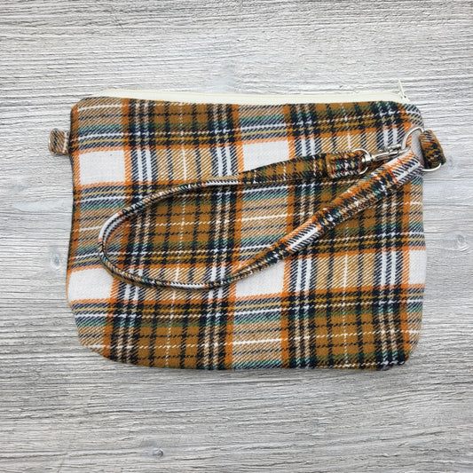 Orange and brown flannel convertible purse.