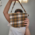 Load image into Gallery viewer, Orange and brown flannel small purse.
