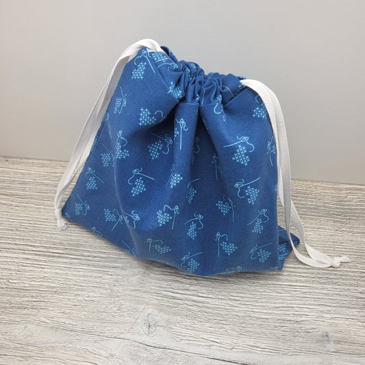 Dark blue drawstring bag to store cross stitch supplies and small projects.