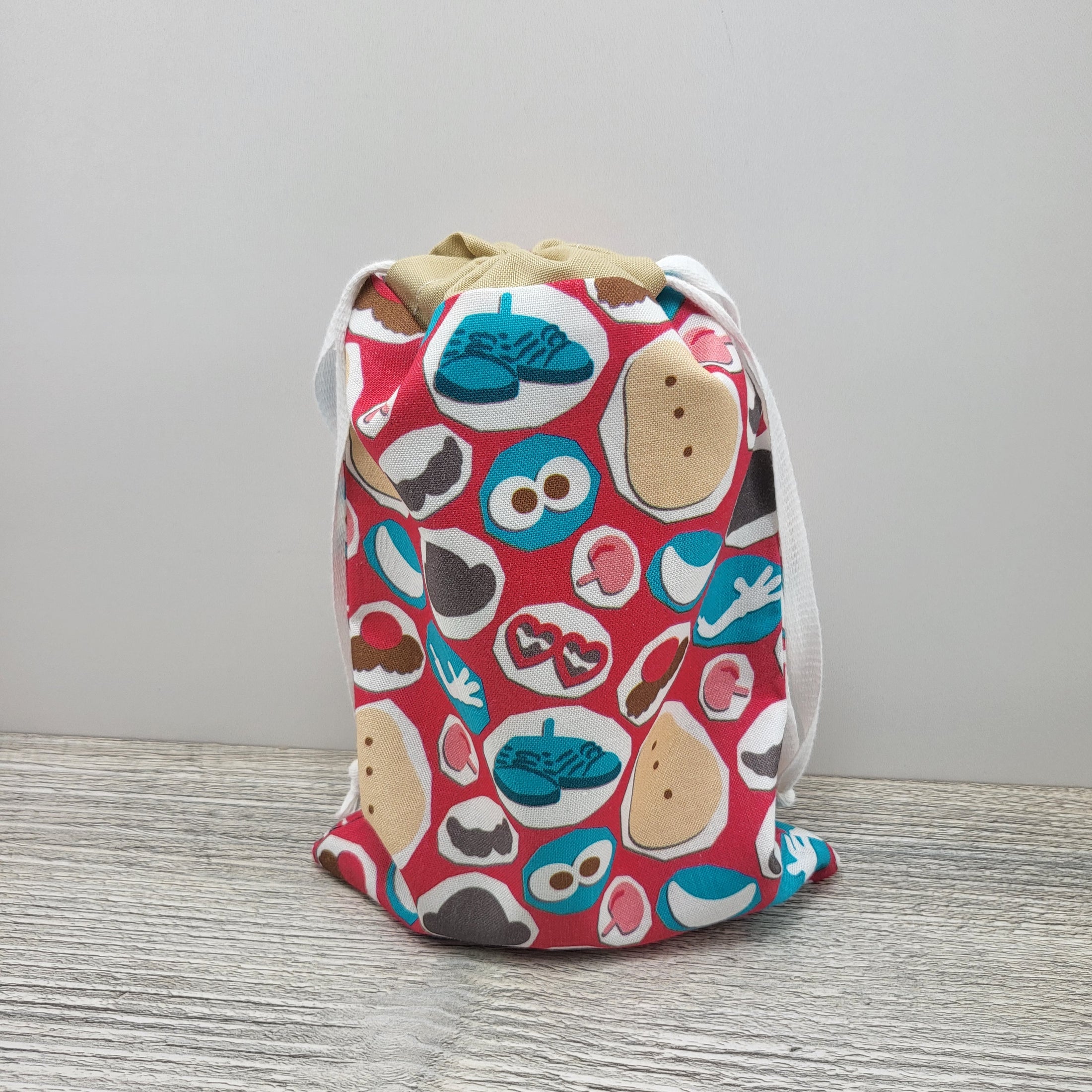 Small drawstring bag to hold Mr. Potato Head pieces and parts. 