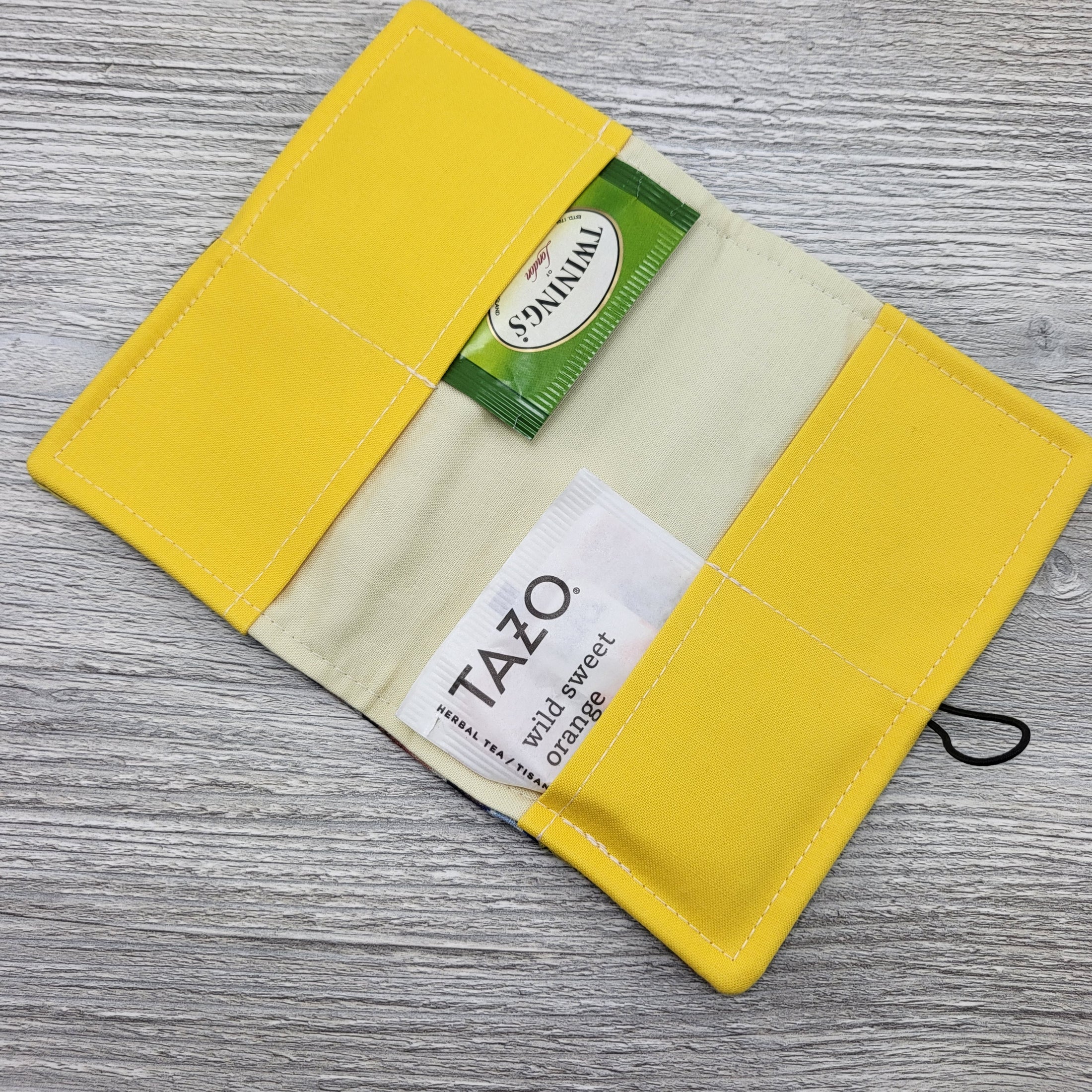 Yellow and cream interior of tea bag wallet.