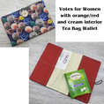 Load image into Gallery viewer, Votes for women tea bag wallet with orange-reddish and cream interior.
