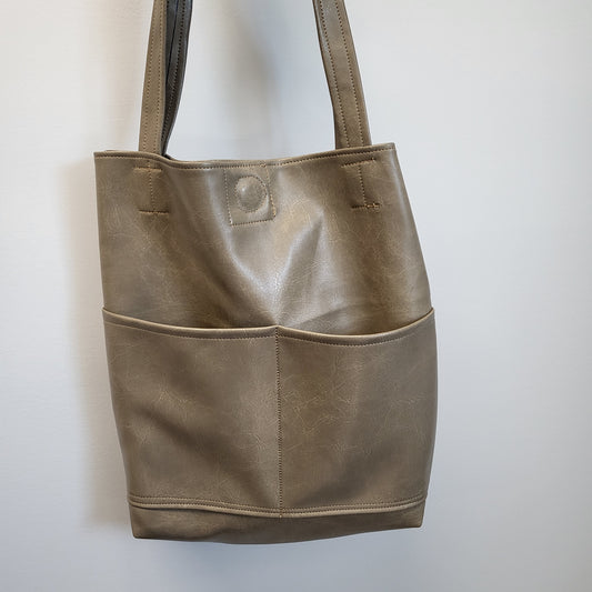 Taupe distressed faux leather tote bag.