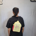 Load image into Gallery viewer, Dear person behind me mental health awareness sling bag being worn by a person with a black shirt.

