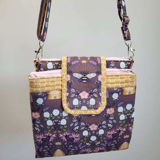 Queen Bee bifold convertible purse with adjustable and removable strap. 