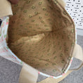 Load image into Gallery viewer, Light brown with green flowers interior of the bluebirds tote bag.
