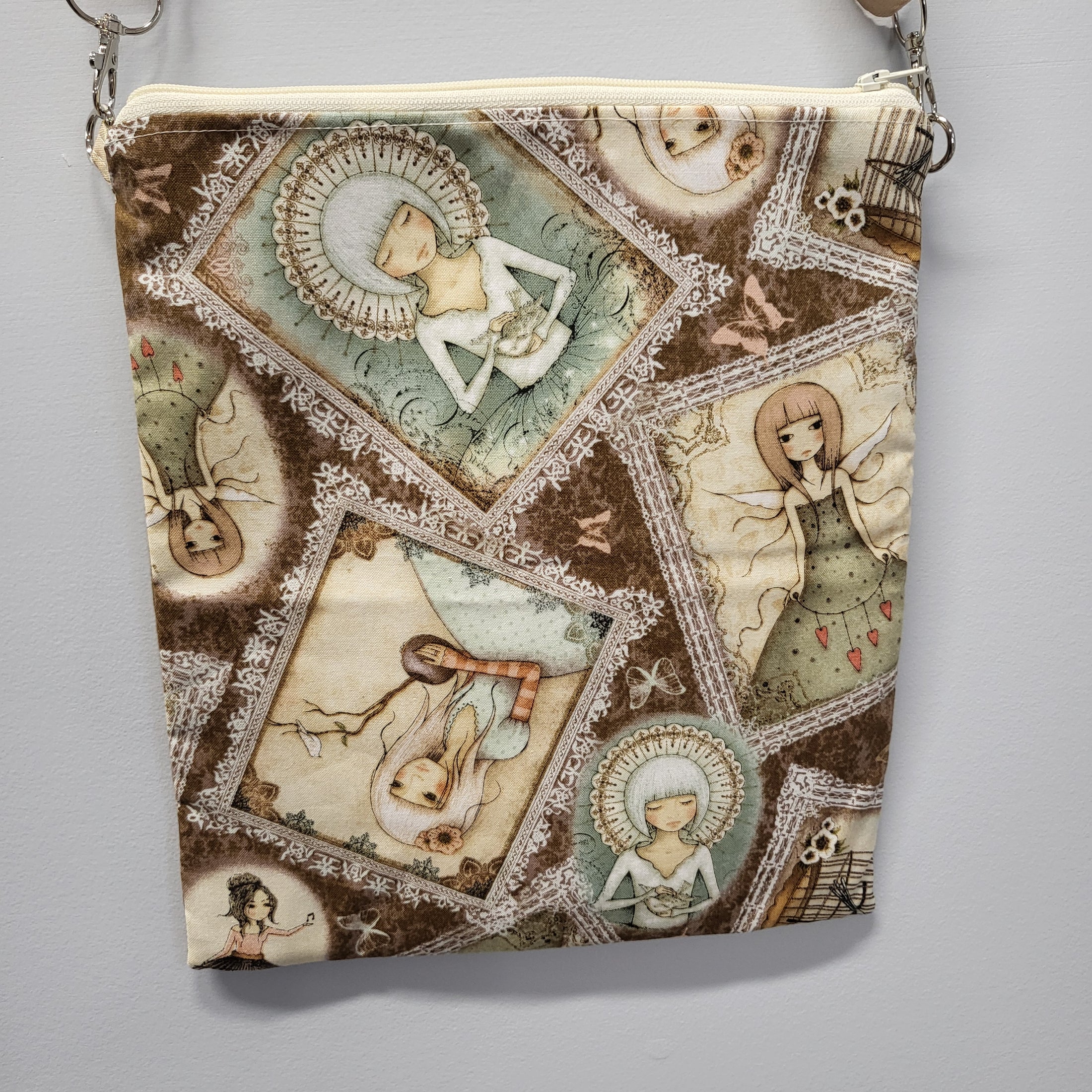 Back of the heart fairy purse with images of other fairies scattered.