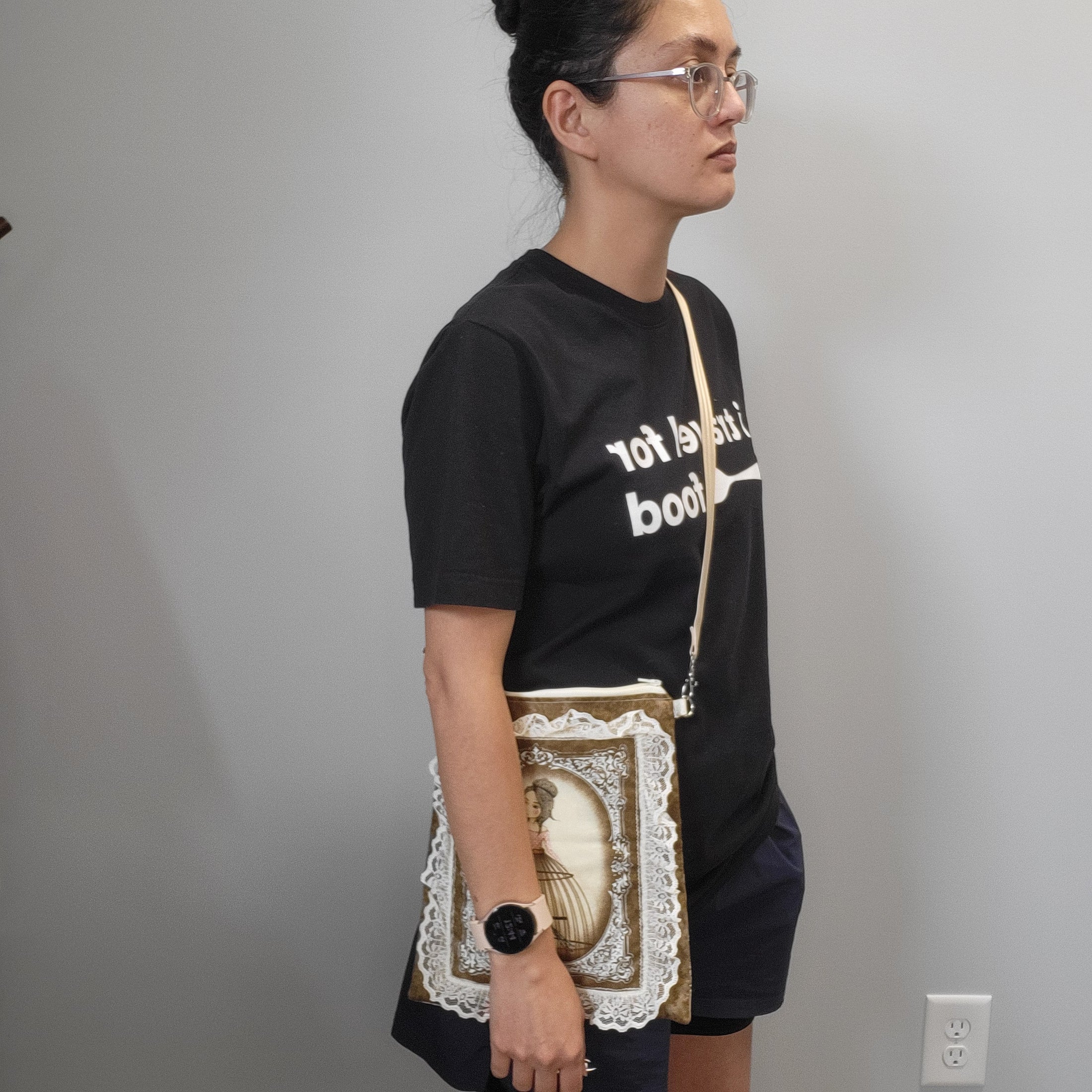 Person wearing the musical lady purse as a crossbody. 