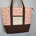 Load image into Gallery viewer, Padded cherry blossom tote bag with zippered main compartment and 2 exterior slip pockets. 
