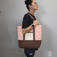 Load image into Gallery viewer, Lady wearing the cherry blossom tote bag on shoulder. 
