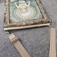 Load image into Gallery viewer, Zipper and adjustable and removable strap on the serenity and calm white dove purse. 
