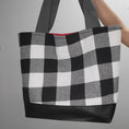 Load image into Gallery viewer, Black and white flannel tote bag with vegan leather black bottom. 
