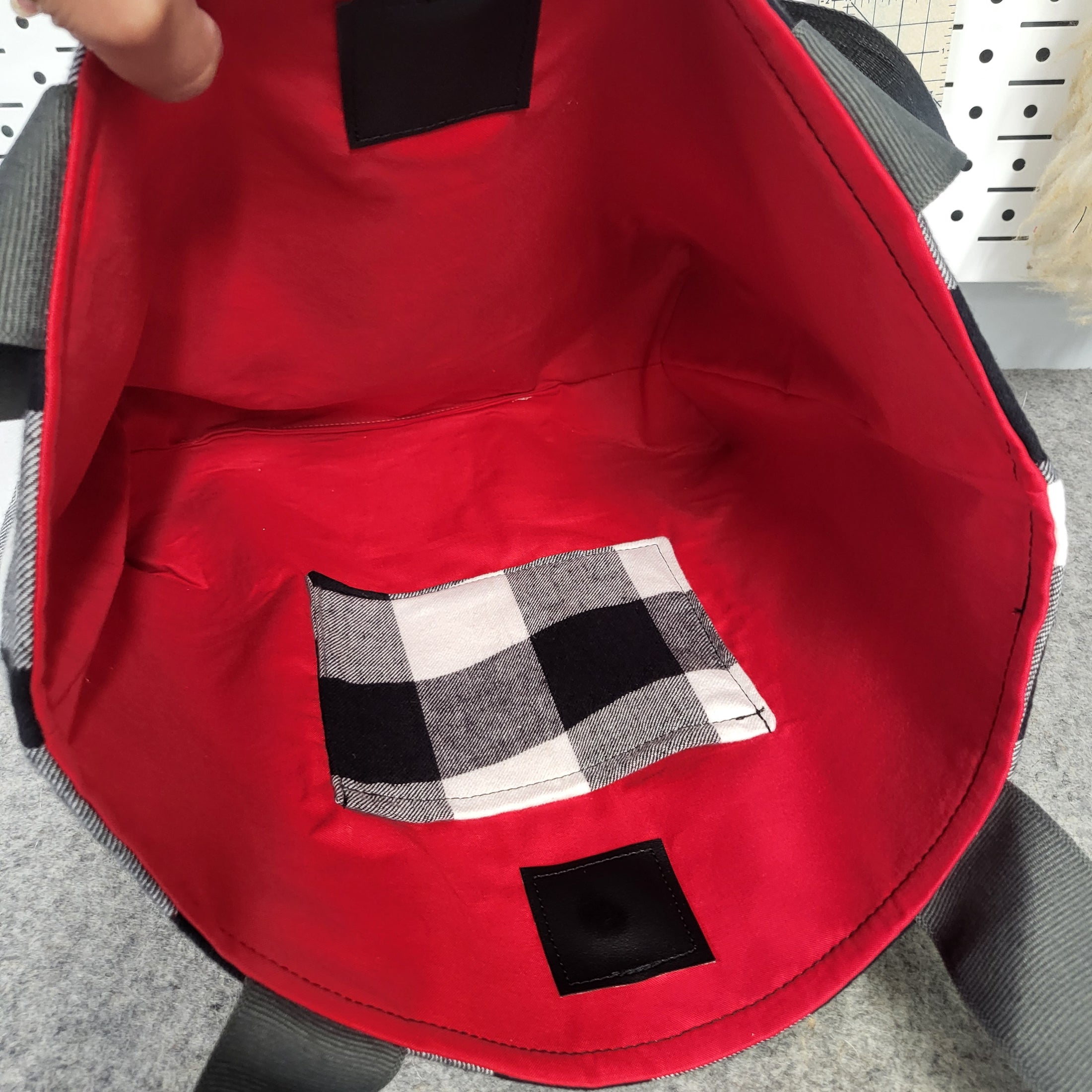 Black and white flannel tote with red interior.