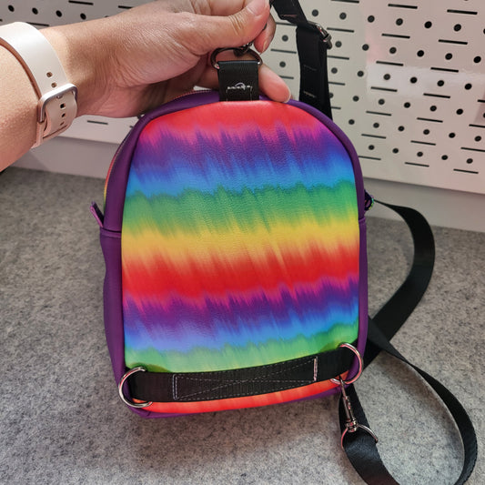 You are enough sling bag with rainbow back. 