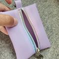 Load image into Gallery viewer, Light purple mini zipper pouch with rainbow zipper tape included with the Mario Kart inspired bag. 
