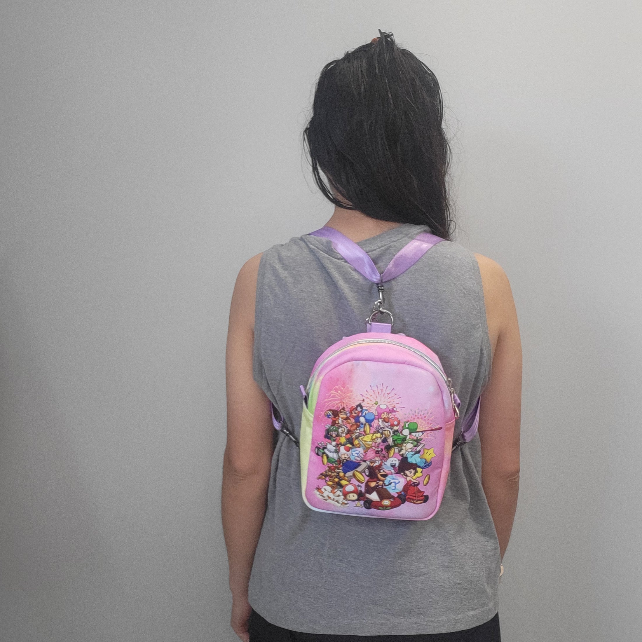 Person wearing the Mario Kart inspired bag as a backpack.