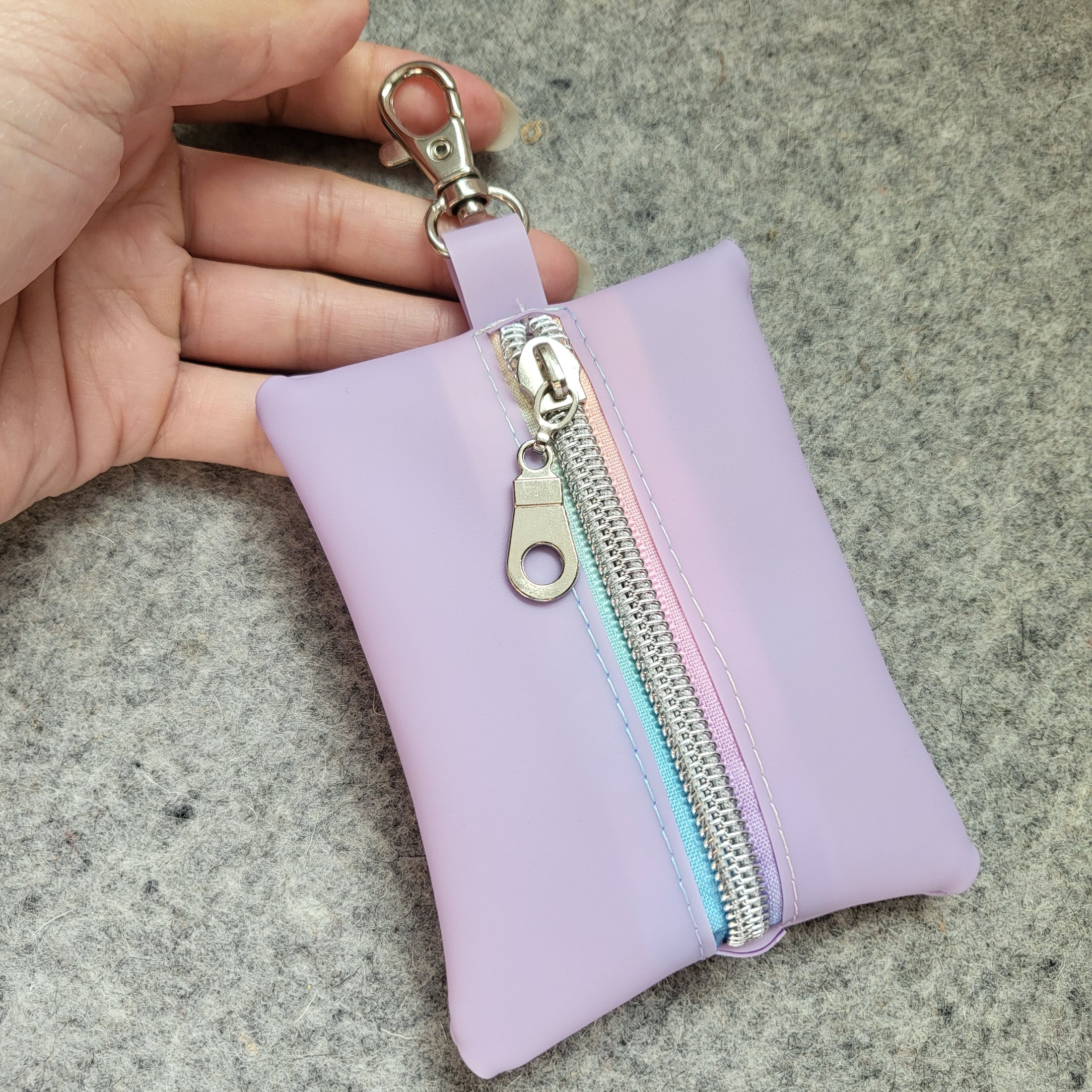 Light purple mini zipper pouch included with the Mario Kart inspired bag. 